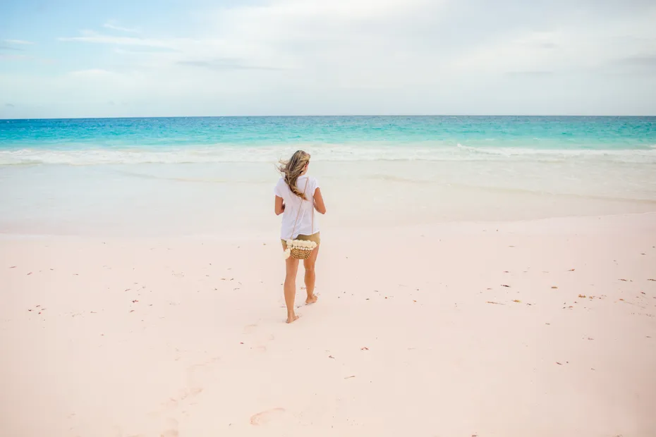 women pink sand beach